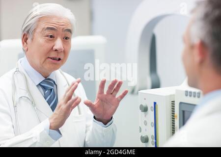 Doctors with MRI scanner Stock Photo