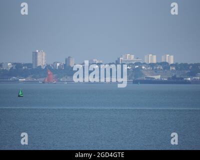 Sheerness, Kent, UK. 11th August, 2021. UK Weather: a sunny and warm morning in Sheerness, Kent. A Thames barge seen close to the end of Southend on sea pier. Credit: James Bell/Alamy Live News Stock Photo
