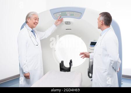 Doctors with MRI scanner Stock Photo