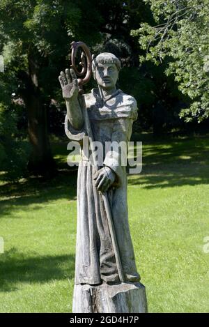 London, England, UK. Wooden sculpture of 'Black Canon with sceptur' by carver Tom Harvey, in the grounds of Lesnes Abbey - ruins of C12th Abbey of St Stock Photo