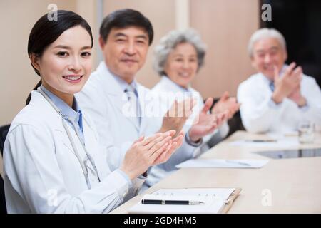 Medical experts clapping Stock Photo