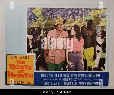 ERROL FLYNN and JULIETTE GRECO with African Natives in THE ROOTS OF HEAVEN 1958 director JOHN HUSTON novel Romain Gary screenplay Romain Gary and Patrick Leigh-Fermor music Malcolm Arnold Darryl F. Zanuck Productions / Twentieth Century Fox Stock Photo