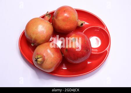 Fresh Pomegranate Fruits Isolated on White Background Stock Photo