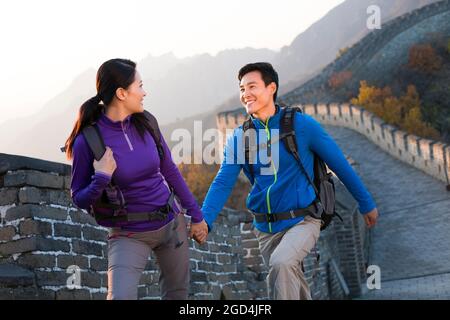 Young couple enjoying autumn outing on Great Wall Stock Photo