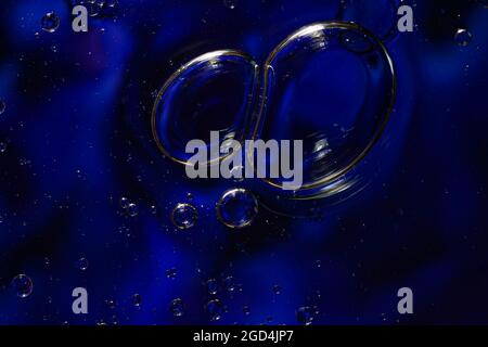 Photo of oil on a water surface with bubbles. Abstract colorful background. Macro close-up, not illustration Stock Photo