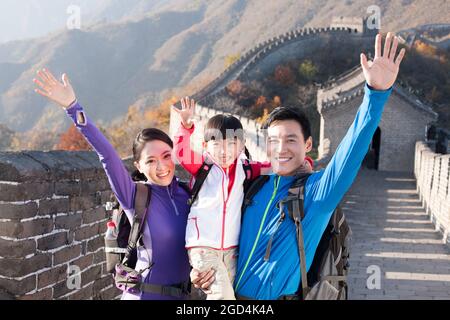 Young family enjoying autumn outing on Great Wall Stock Photo