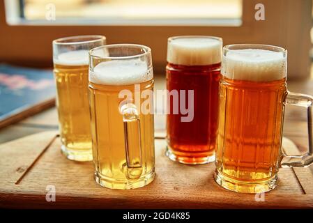 Beer set in the pub. Different kind of beer in glasses on table Stock Photo