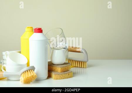 Concept of Dishwashing detergent accessories on kitchen background Stock  Photo - Alamy