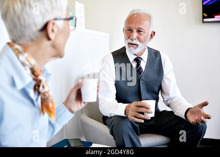 senior busniess people talking office communication Stock Photo