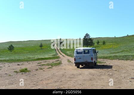 Travelling by Russian old car in Olkhon island Stock Photo
