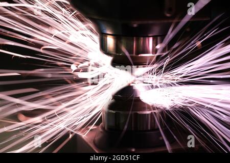 Laser cut machine industrial metal processing process closeup background Stock Photo