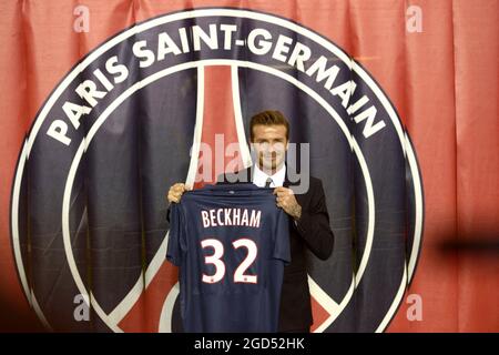 File photo dated January 31, 2013 of British and New PSG football player David Beckham poses with his PSG Football shirt after his PSG signature at the Parc des Princes stadium in Paris, France. Since the arrival of the Qataris at the head of PSG in 2011, the club has managed to attract the biggest names in its squad. A long list of stars that Lionel Messi is joining. Photo by Mousse/ABACAPRESS.COM Stock Photo
