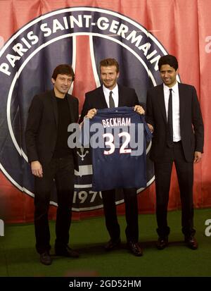 File photo dated January 31, 2013 British and New PSG football player David Beckham flanked by PSG Qatari president Nasser Al-Khelaifi (L) and Brazilian sport director Leonardo, poses with his new jersey at the end of a press conference at the Parc des Princes stadium in Paris, France on. Since the arrival of the Qataris at the head of PSG in 2011, the club has managed to attract the biggest names in its squad. A long list of stars that Lionel Messi is joining. Photo by Mousse/ABACAPRESS.COM Stock Photo
