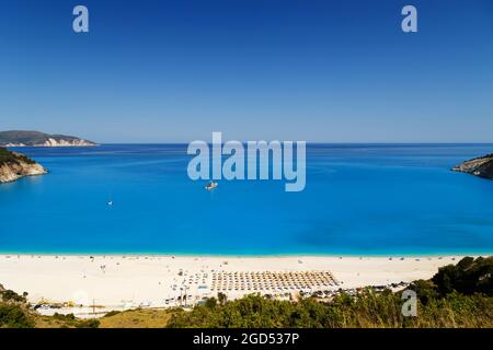 Fantastic panoramic top view at Myrtos Beach with turquoise and blue Ionian Sea water. Summer scenery of famous and extremely popular travel destination in Cephalonia, Greece, Europe Stock Photo