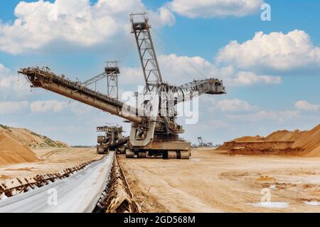 Giant bucket wheel excavator. The biggest excavator in the world. The largest land vehicle. Excavator in the mines. Stock Photo