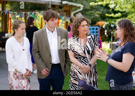 Captain Sir Tom Moore's daughter Hannah Ingram-Moore alongside his grandchildren Benjie Ingram-Moore and Georgia Ingram-Moore during the official opening of a new garden at the Helen and Douglas House children's hospice in Oxford. Picture date: Wednesday August 11, 2021. Stock Photo