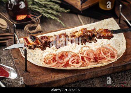 Grilled georgian lamb ribs shashlik skewers Stock Photo