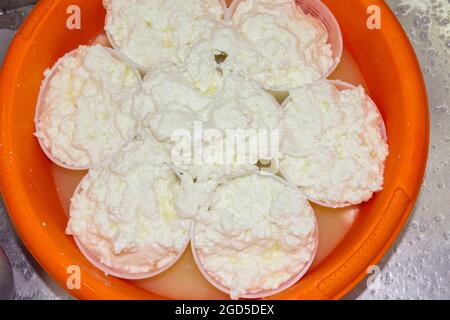 phases of ricotta production in a cheese factory in Greece Stock Photo