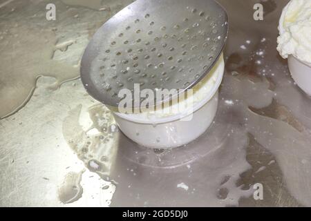 phases of ricotta production in a cheese factory in Greece Stock Photo