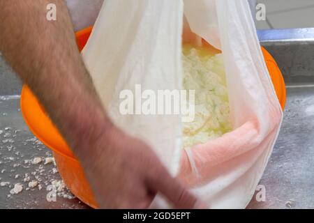 phases of ricotta production in a cheese factory in Greece Stock Photo