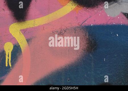 Abstract spray painted shapes background. Overlapping graffiti on textured wall. Stock Photo