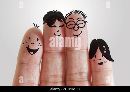 painted smiley on human fingers Stock Photo Alamy