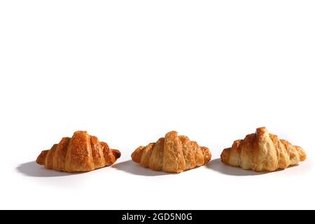 Croissant isolated in  wihite background with sunny light Stock Photo