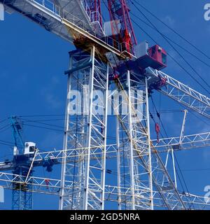 Multiple exposer of two construction cranes at construction site. Ontario Canada. Stock Photo
