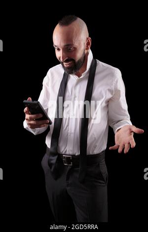 Happy hispanic man gladly surprised by good news Stock Photo