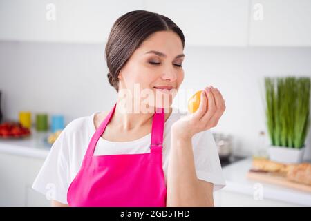 Photo portrait woman smelling scent of fresh tomato. Stock Photo