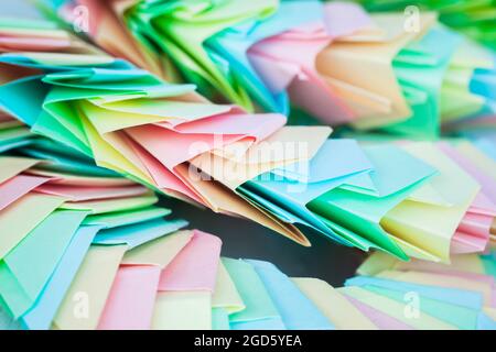 Abstract parametric structure made of colorful paper sheets. Origami background, close up photo with selective focus Stock Photo
