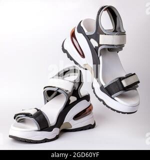 Women's, fashionable, sports sandals on a white background. New youth shoes for girls. Foreground. Stock Photo