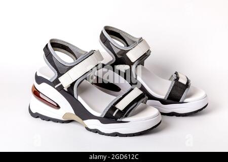 Women's, fashionable, sports sandals on a white background. New youth shoes for girls. Foreground. Stock Photo