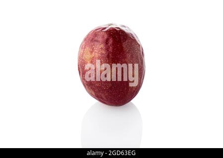 Passion fruit. Single passion fruit on a white background. Stock Photo