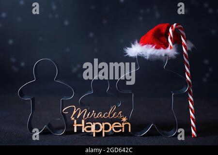 Christmas cookie cutters in shape of gingerbread mans. Happy family holidays concept. Stock Photo