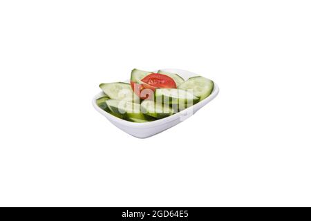Cucumber. sliced cucumber in white plate on a white background. Stock Photo