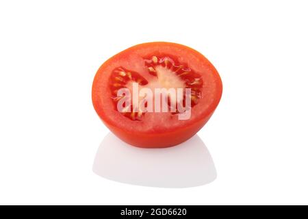 Sliced tomato - Single half tomato facing up on a white background Stock Photo