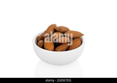 Almond. Almond in white bowl, on white background Stock Photo