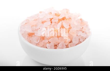 Himalayan salt, pink himalayan salt. himalayan salt in white bowl,  on white background Stock Photo