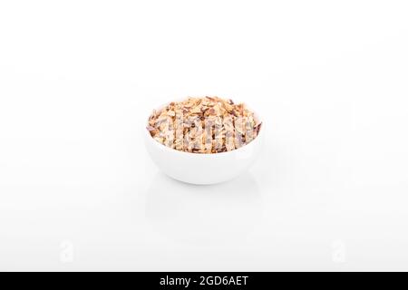 chopped scallion. chopped scallion in white bowl on white background. chopped scallion, dried Shallots Flakes, dry onion, onion flakes. macro shot Stock Photo