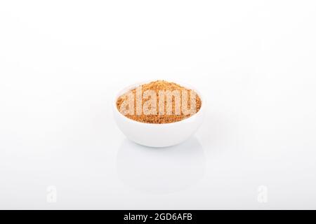 coconut sugar, granulated coconut sugar. coconut sugar in white bowl on white background. Stock Photo