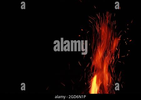 Bright sparks of fireworks on a dark background with a place for the title. High quality photo Stock Photo