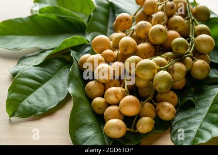 Closeup shot of harvested Burmese grapes on a table Stock Photo