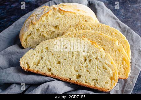 Slices of French Bread in a Linen Napkin: Sliced French bread on a cloth napkin Stock Photo