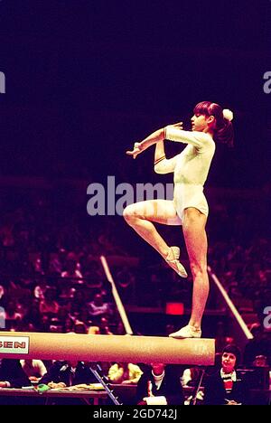 Nadia Comaneci (ROM) performs on the balance beam at the 1976 American Cup, New York, NY Stock Photo