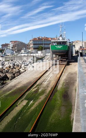 LLANES, SPAIN - January 12, 2020: 'El Reviru' fishing boat standing on the slip in the port of LLanes, Asturias, Spain.