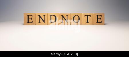 Endnote was created from wooden cubes. News and journalism concepts. close up. Stock Photo
