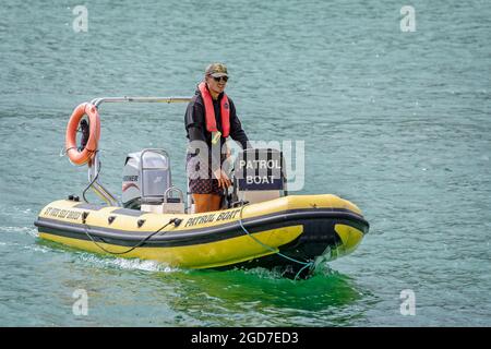Patrol boat policing self drive hire boats in the bay at St Ives, Cornwall, UK on 2 August 2021 Stock Photo