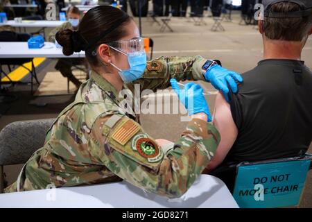 U.S. Air Force Senior Airman Anabell Salcedo, assigned to the 628th Healthcare Operations Squadron at Joint Base Charleston, South Carolina, administers a COVID-19 vaccine to a local community member at the Community Vaccination Center (CVC) in St. Paul, Minnesota, June 7, 2021. The Airmen at the center finish their mission strong and with pride knowing they served the local community. U.S. Northern Command, through U.S. Army North, remains committed to providing continued, flexible Department of Defense support to the Federal Emergency Management Agency as part of the whole-of-government resp