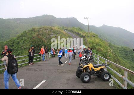 KEDIRI, INDONESIA - March 25, 2016: Tourists enjoying the scenery at the Mount Kelud tourist site Stock Photo